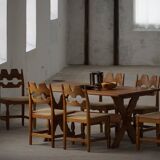 Solid oak dining table with cross base by Danish cabinetmaker, mid-20th century.