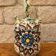 polychrome floral-decorated jug in glazed ceramic