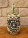 polychrome floral-decorated jug in glazed ceramic