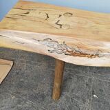 Big bench in solid rough wood very thick Brutalism