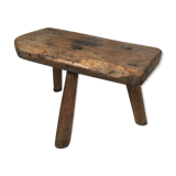 Crude wooden tripod stool