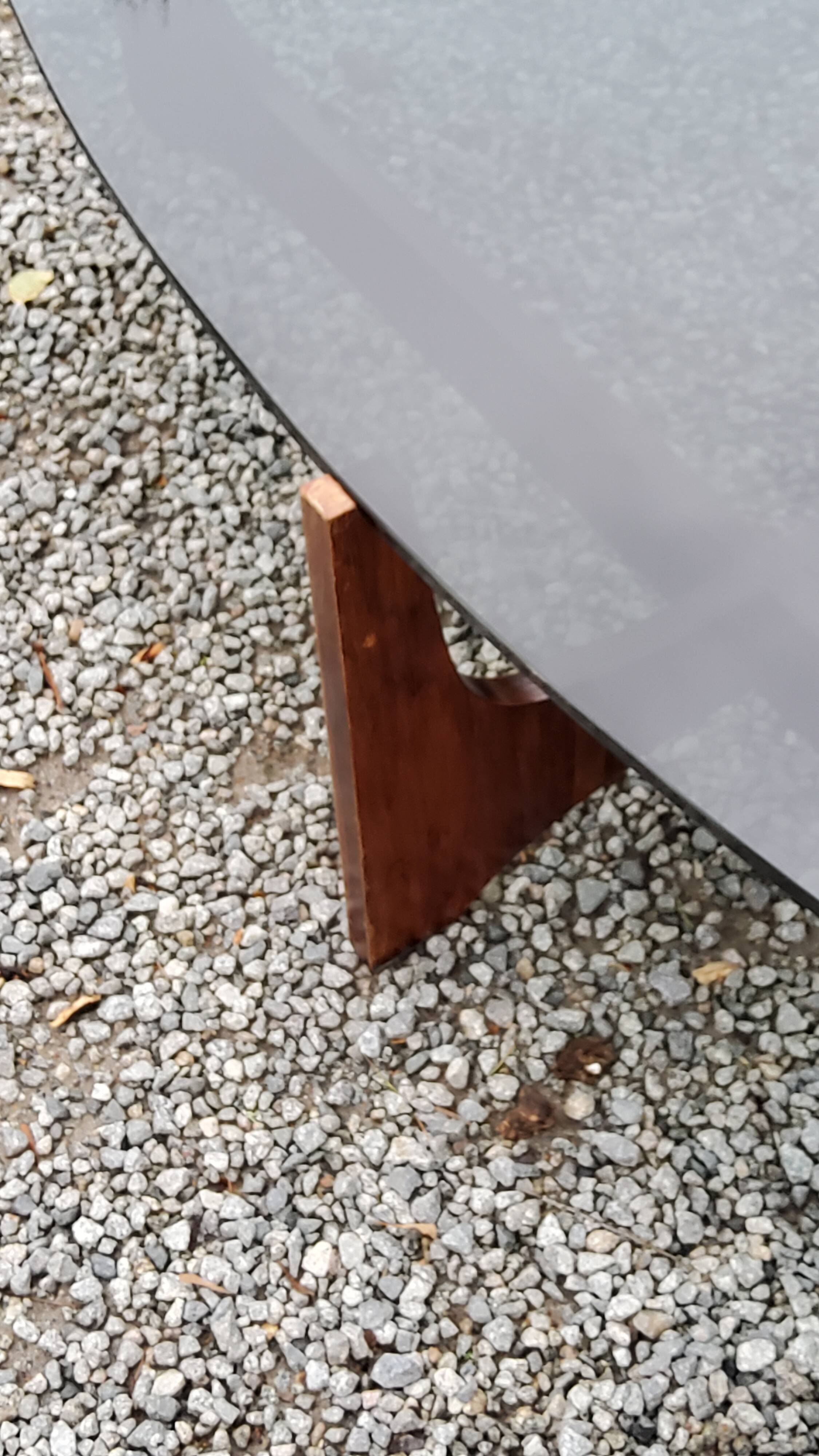 Designer coffee table by Hugues Poignant in rosewood and smoked glass from the 70s