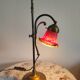 Brass articulated lamp with glass paste signed art of France.