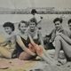 Old film photo circa 1950 the beach group of teenagers