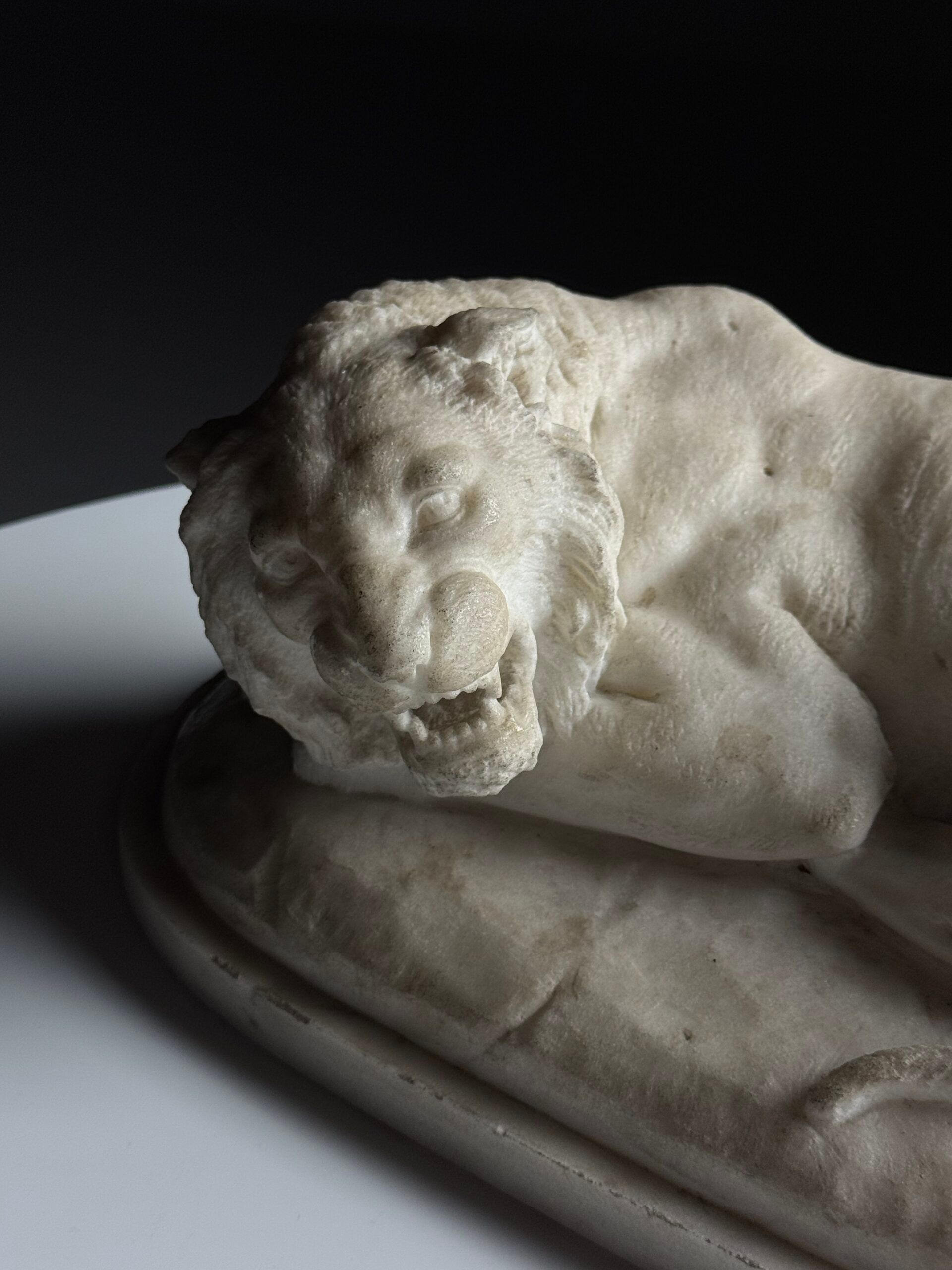 Marble sculpture of a reclining lion