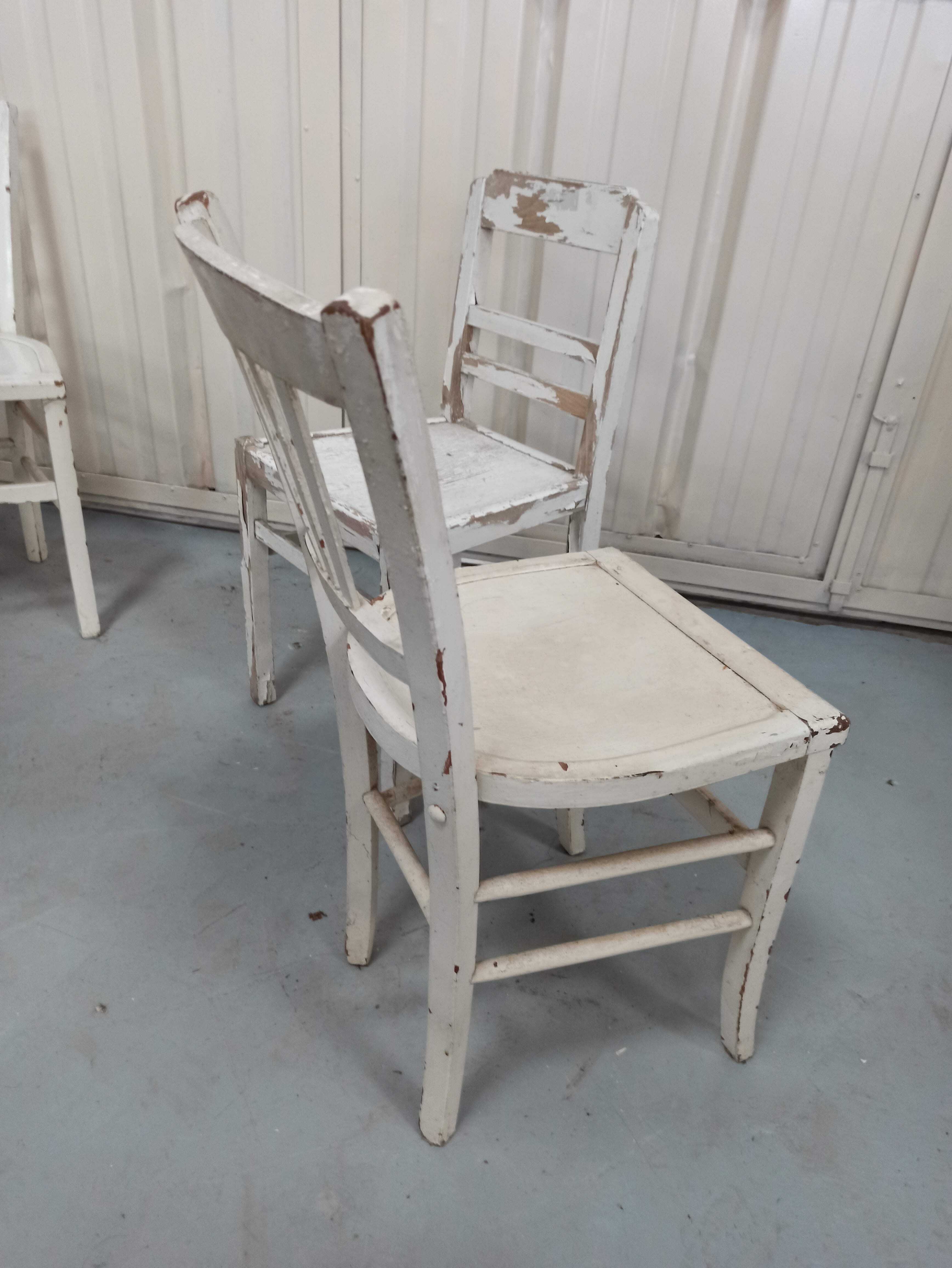 4 patinated white bistro chairs