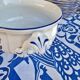 Saladier rond creux vintage KG Lunéville liseré bleu et decor de fleurs bleues et jaunes