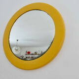 Round wall mounted mirror in yellow plastic 1970