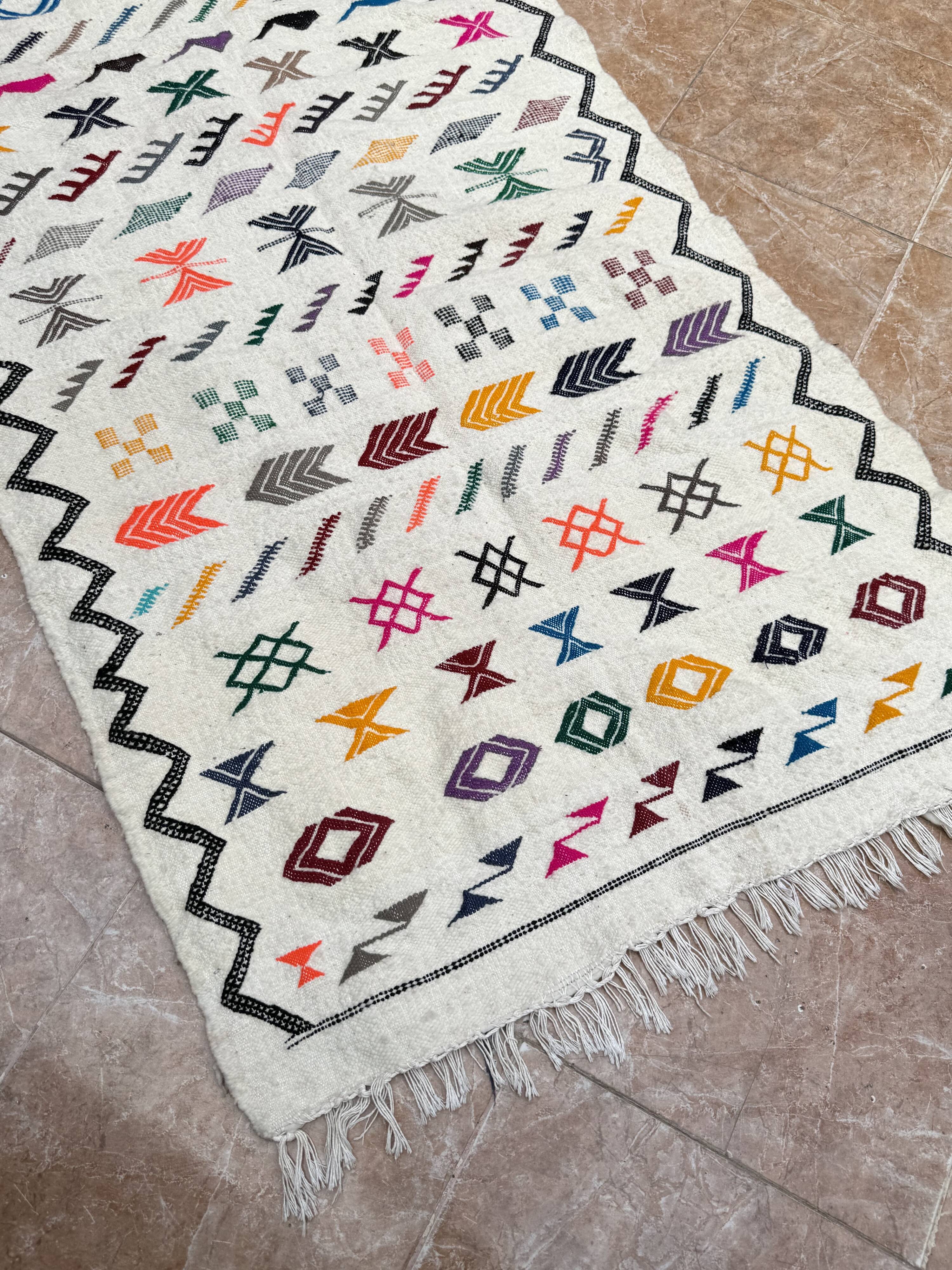 Handwoven Berber kilim rug: small Moroccan decorative rug.