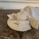 Marble sculpture, man's head in a hat.