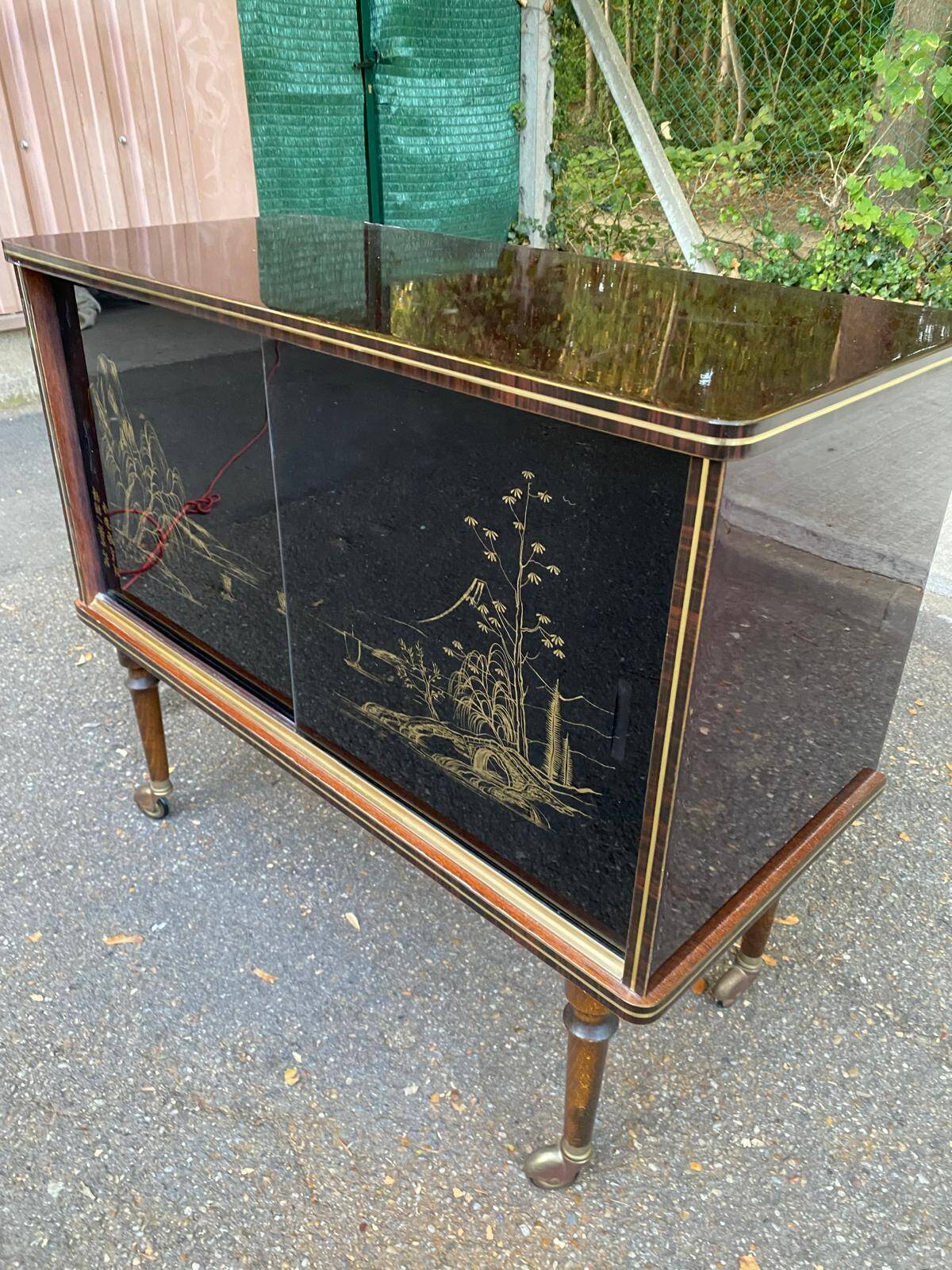 Illuminated bar cabinet Hollywood Regency black and gold 1970