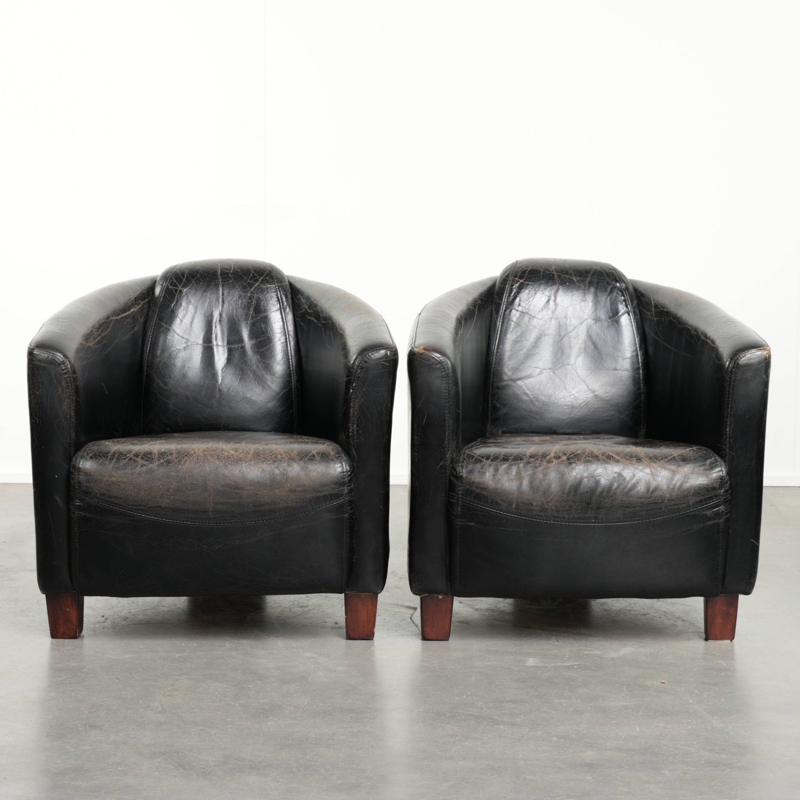 Set of two black vintage cowhide aviator design armchairs