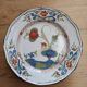 Eastern earthenware plate decorated with a ripe poppy flower