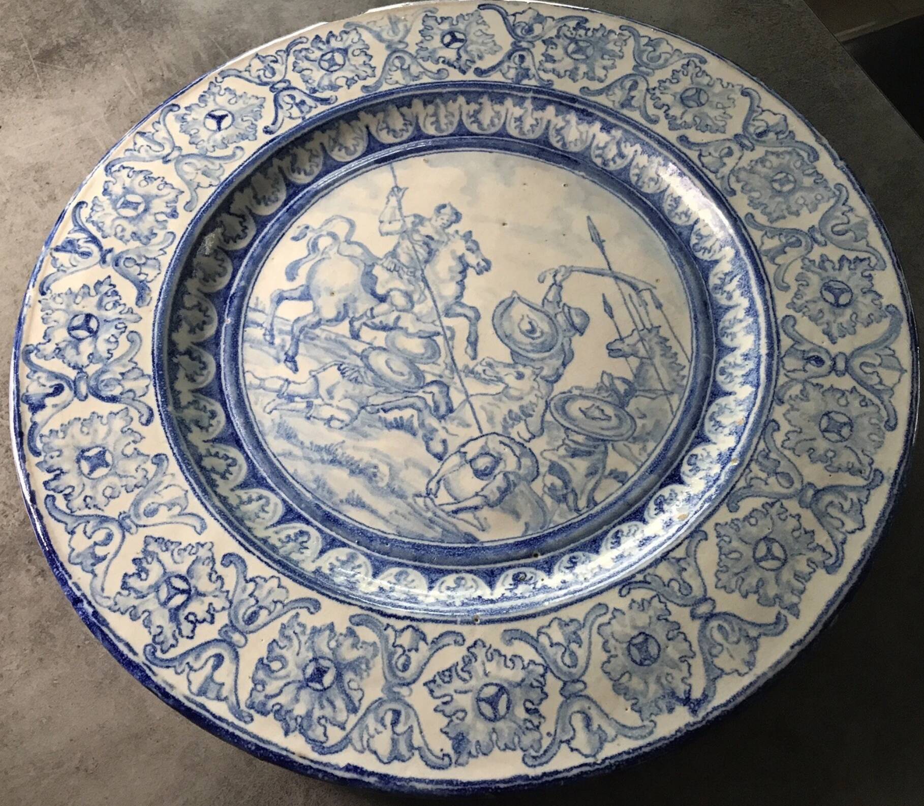 Antique glazed ceramic wall plate with battle scene decoration 41.5 cm