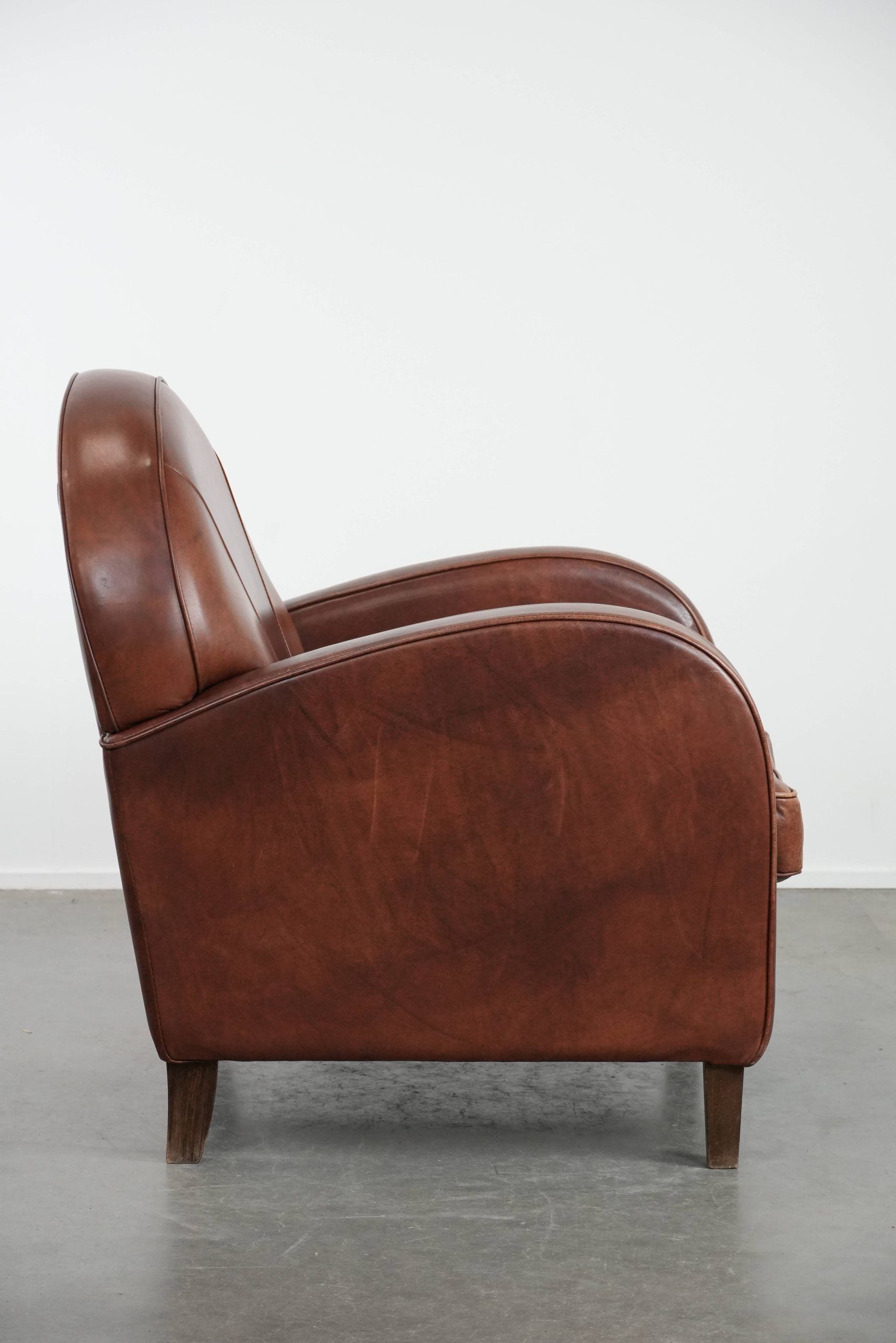 Beautiful art deco design armchair made of cowhide leather in English style