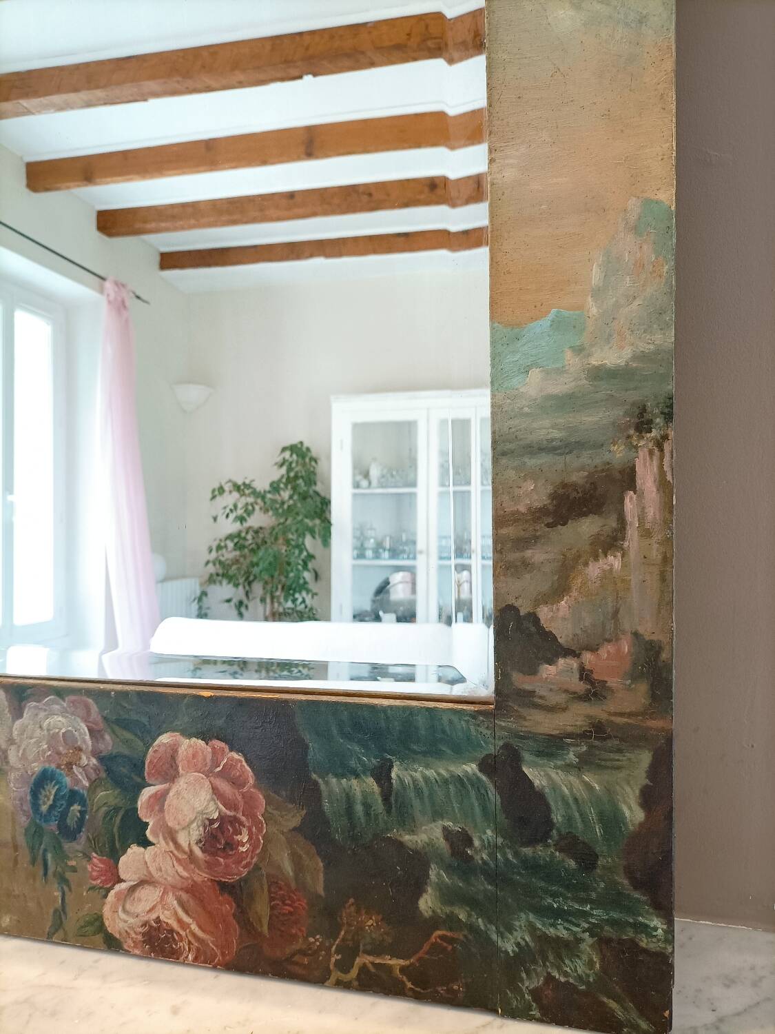 Very large mirror painted in Victorian style.