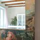 Very large mirror painted in Victorian style.