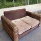 Exotic 2-seater sofa in woven banana tree / rattan and brown fabric.