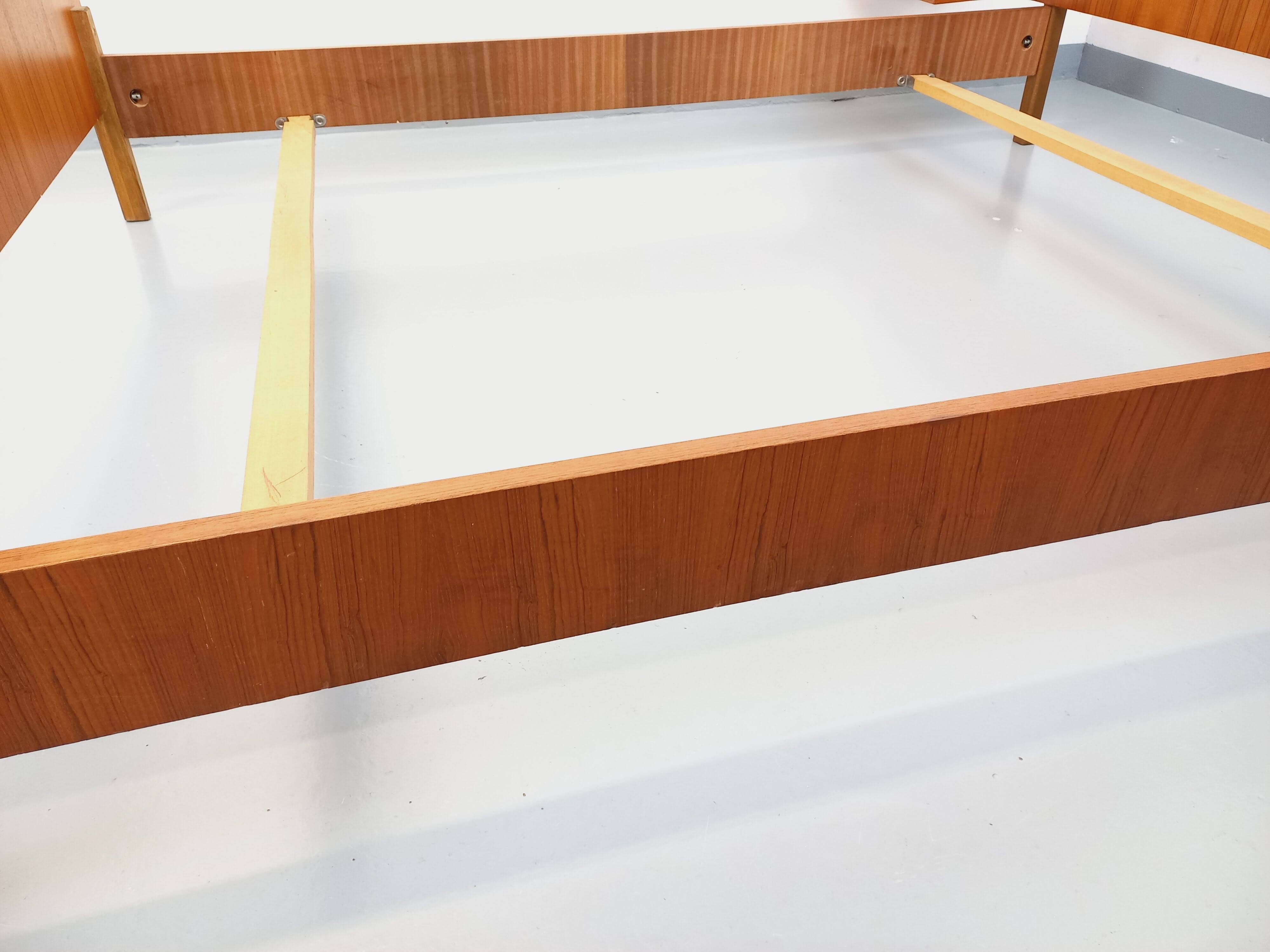 Vintage Scandinavian style double bed in teak from the 60s with integrated bedside lights