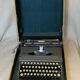Triumph perfekt typewriter with its transport box.