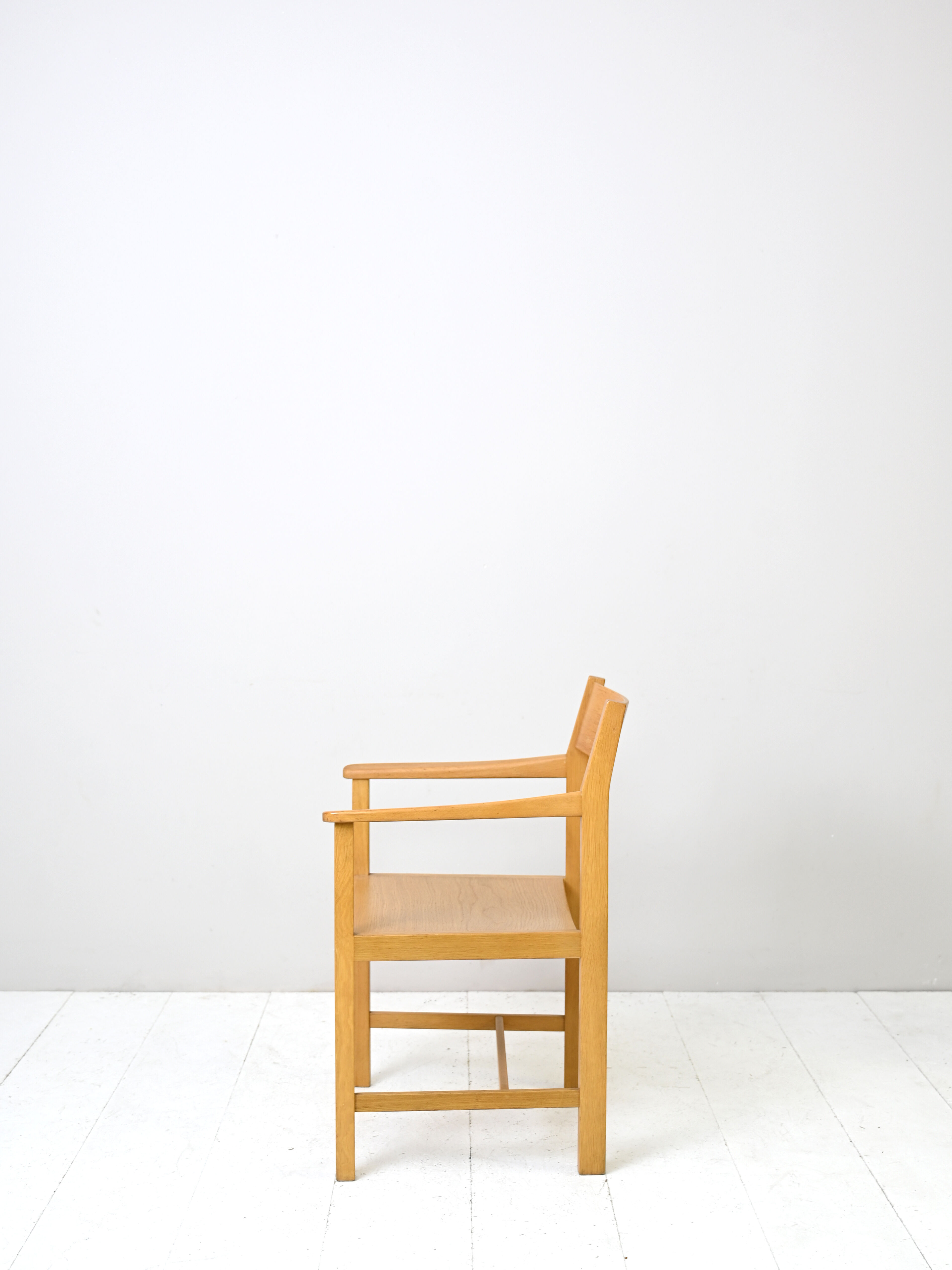 Wooden chair with armrests