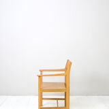 Wooden chair with armrests