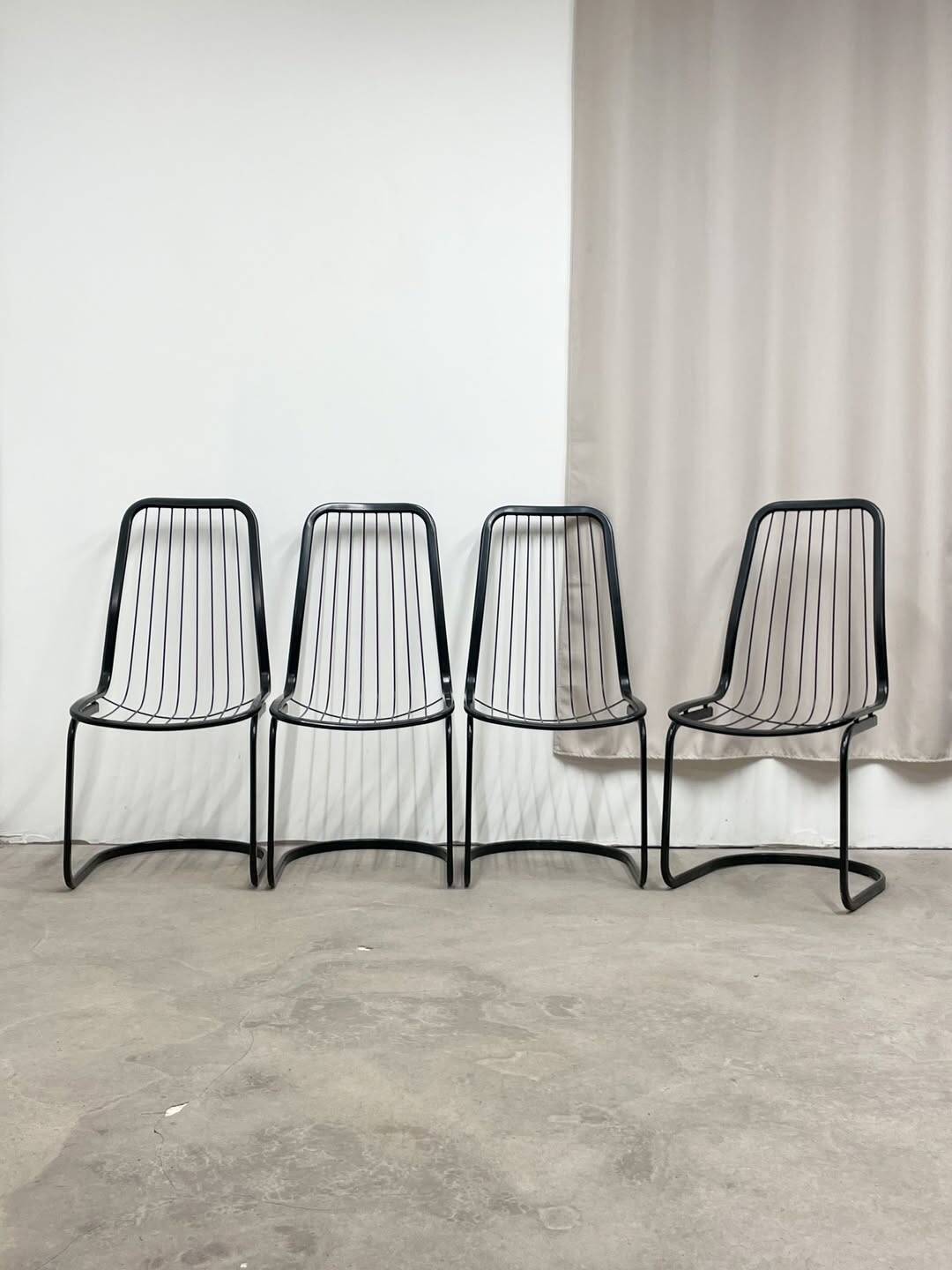 4 black wire metal chairs