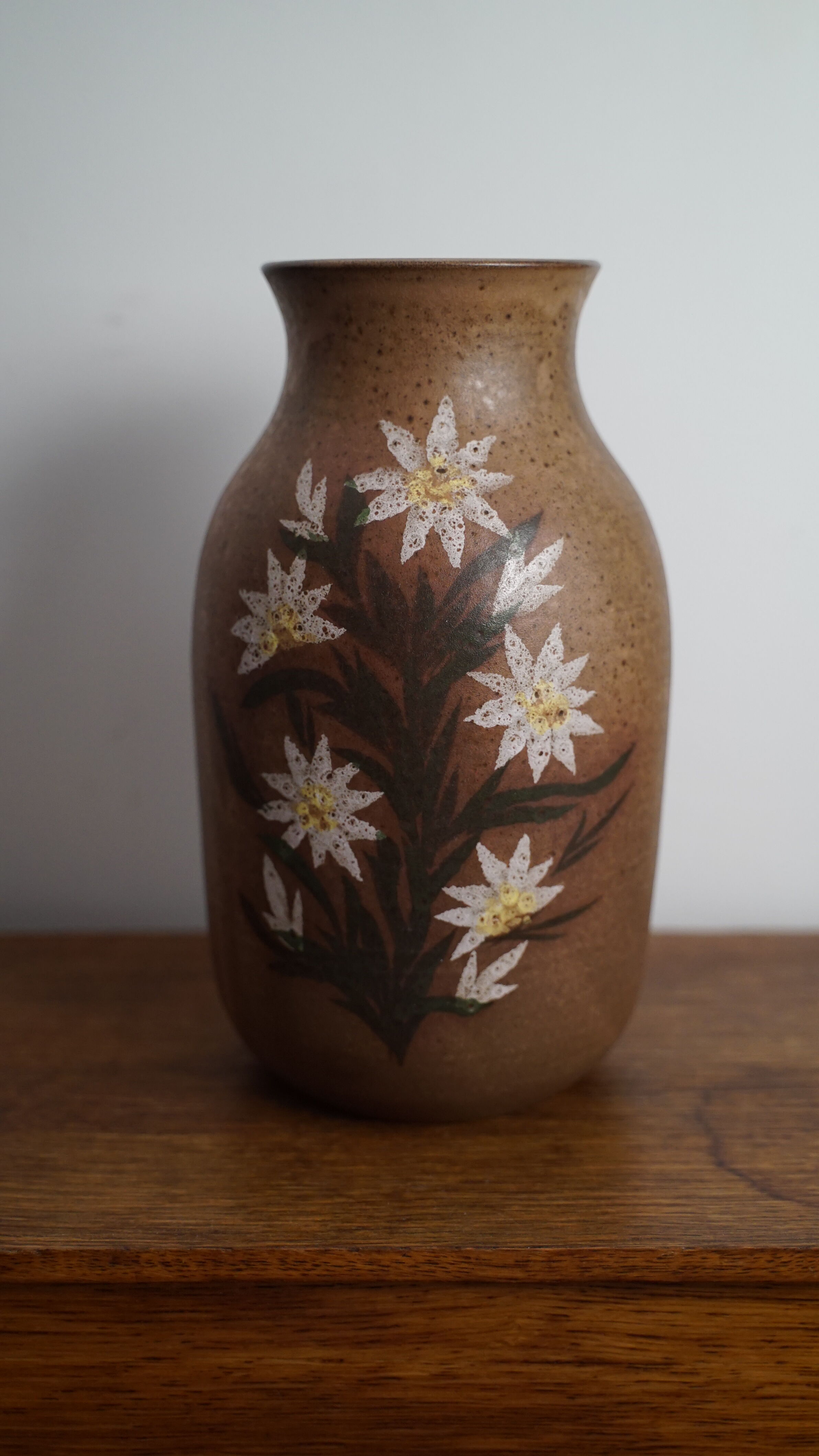 Sandstone vase with flowers 70's