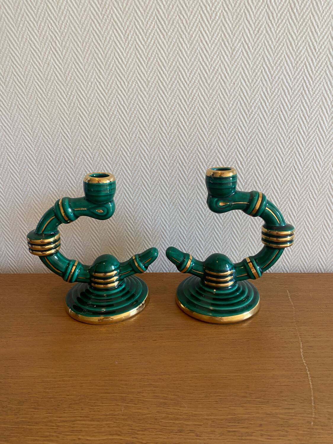 Pair of green and gold ceramic candlesticks