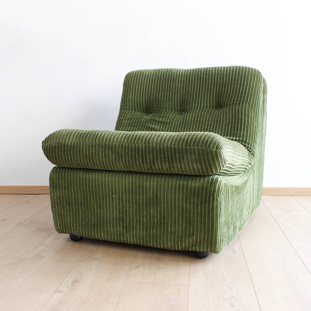 Modular vintage sofa with green cord upholstery
