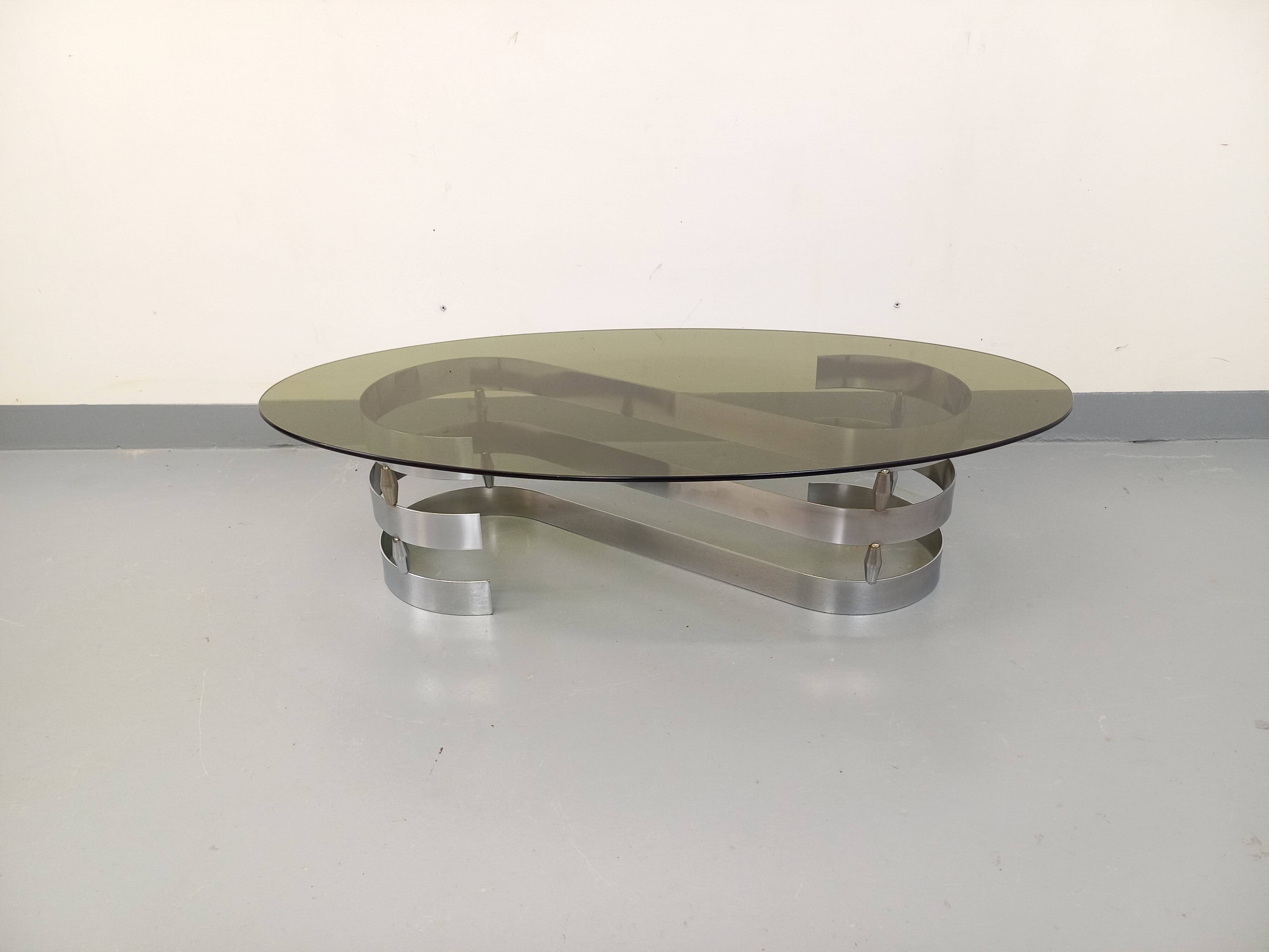 Vintage oval coffee table in smoked glass and chrome metal from the 1970s.
