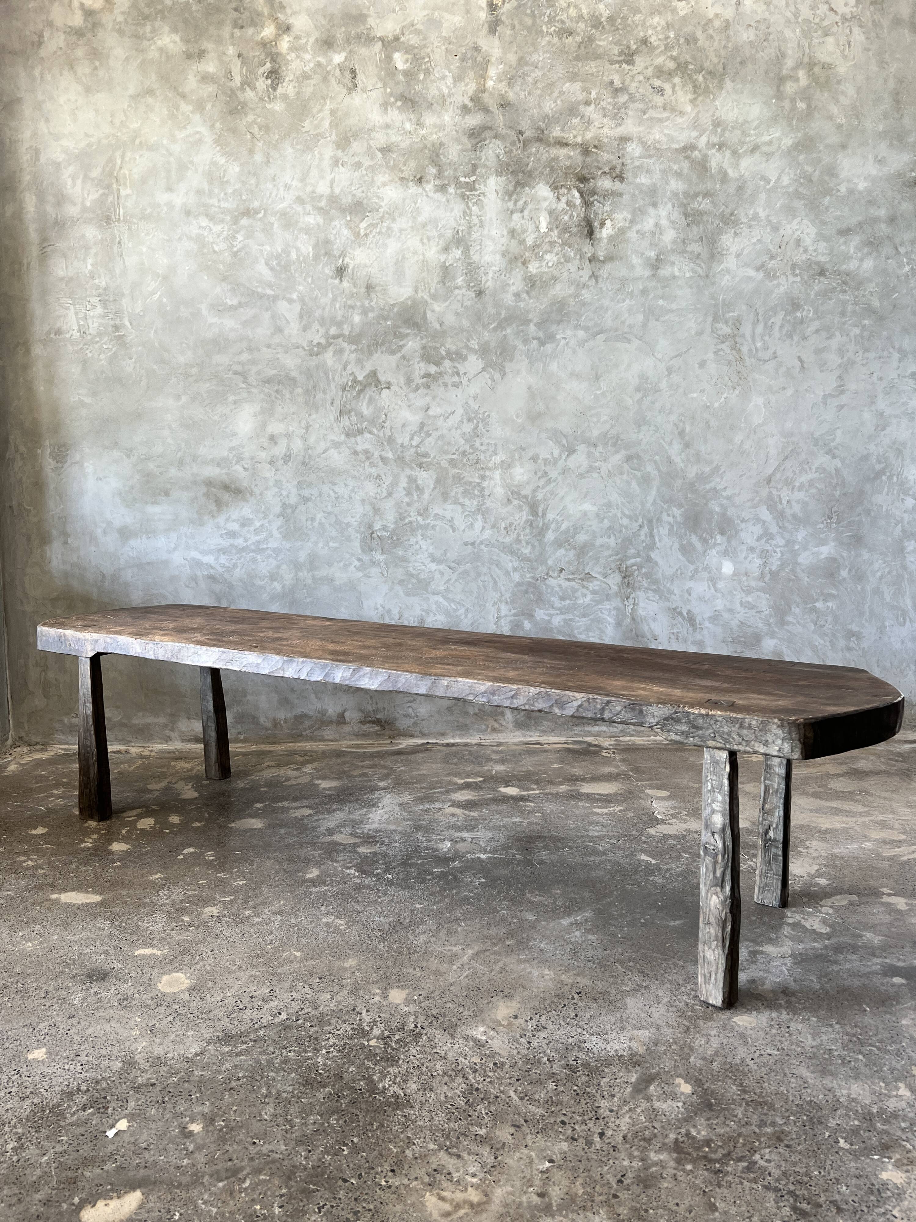 Large rounded coffee table in old Asian teak