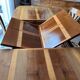 Extendable table in cherry wood with wrought iron legs.