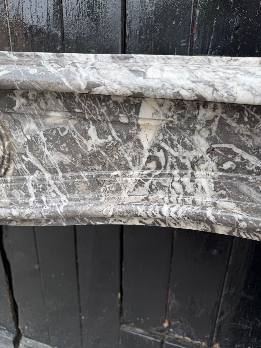 Louis XV fireplace in grey Saint Anne marble, 18th century.