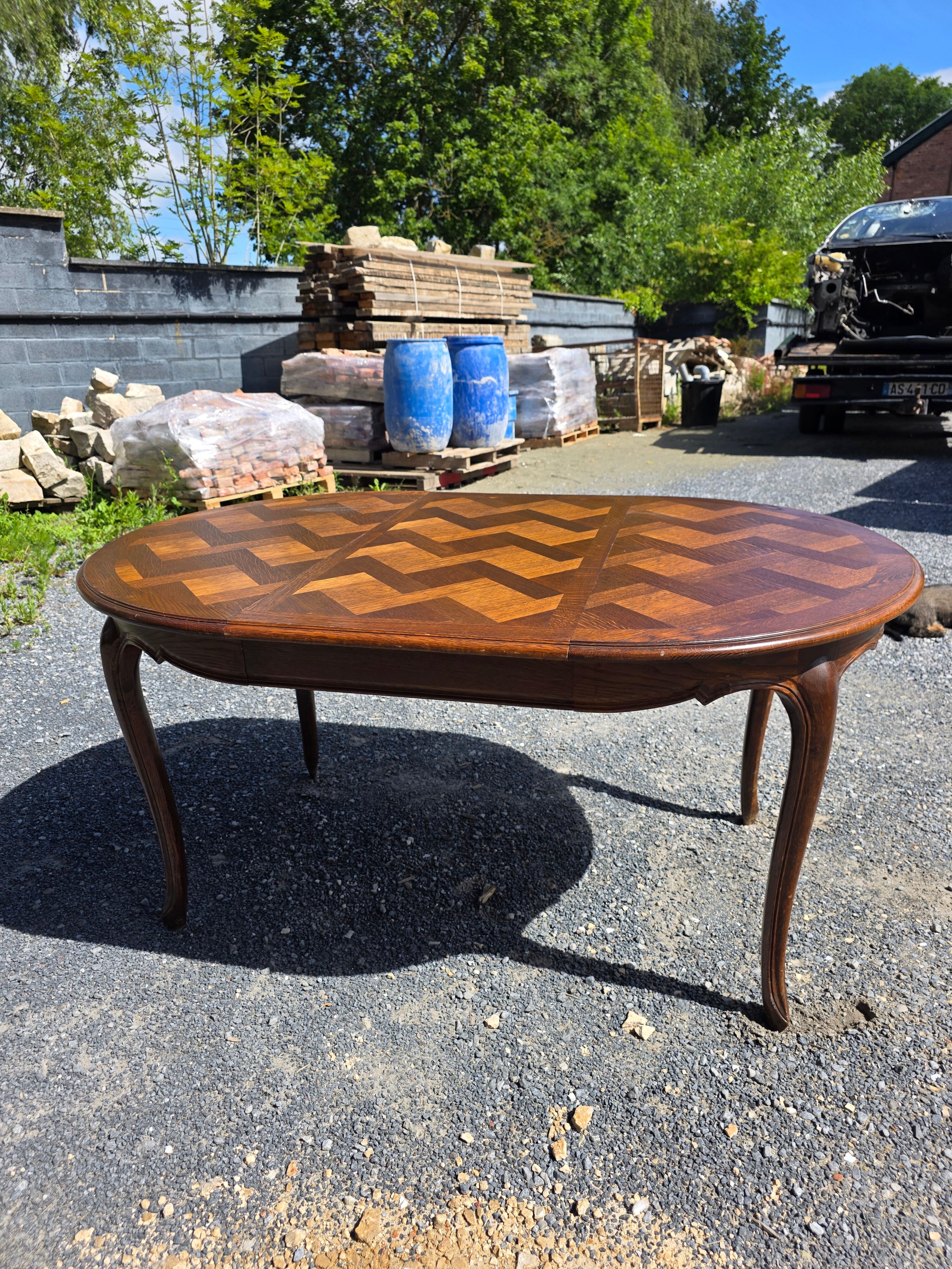 Extendable table in Louis XV style in oak (2 extensions)