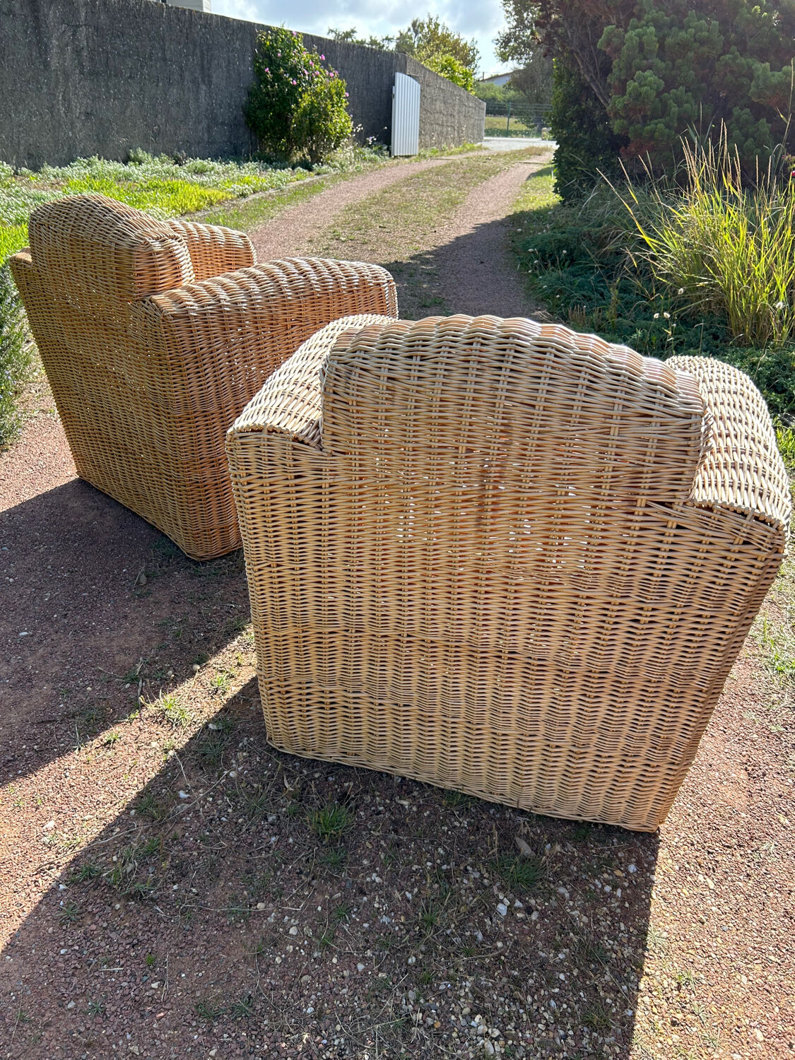Large rattan armchairs