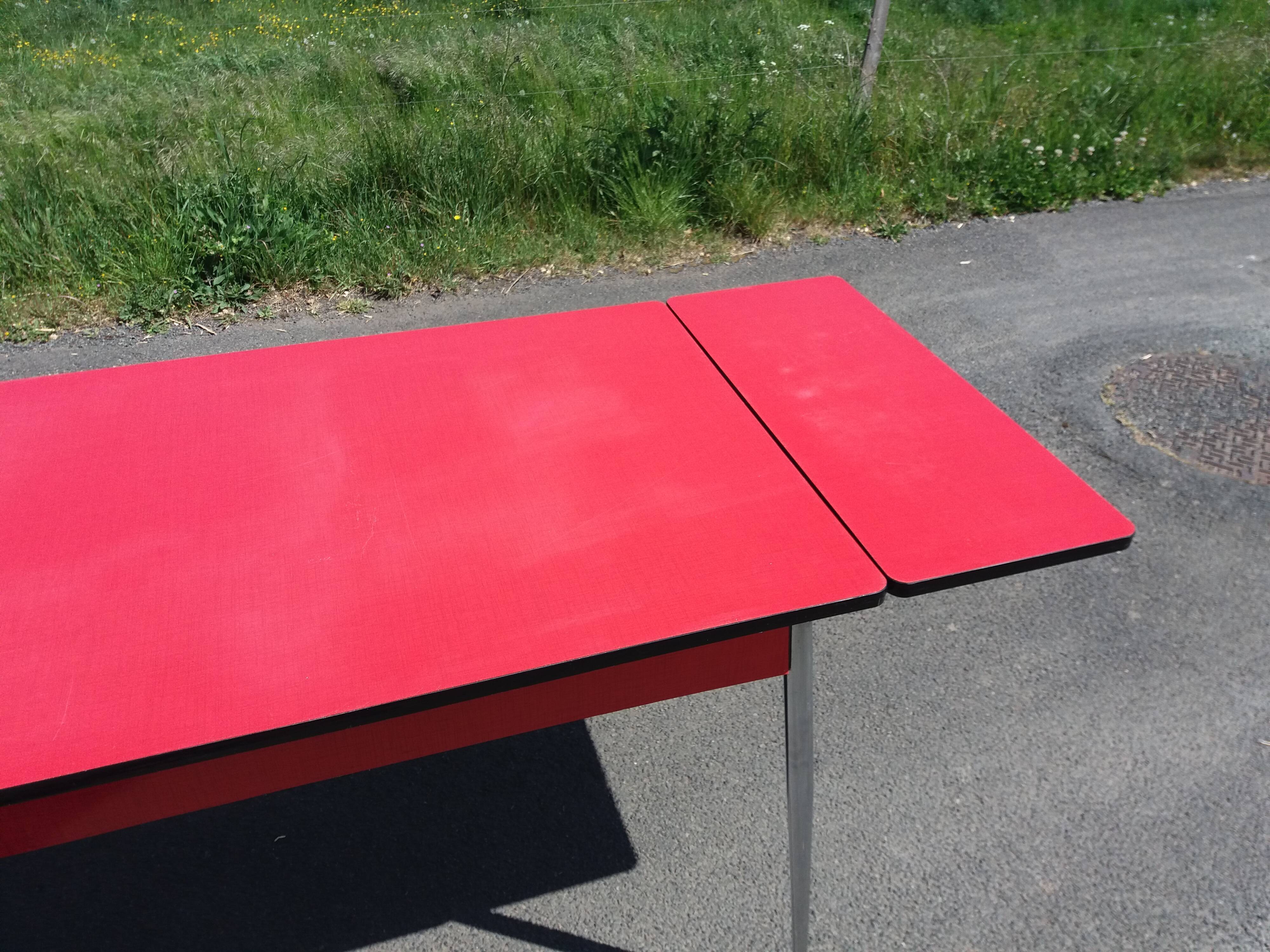Dining table with red formica extensions