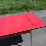Dining table with red formica extensions