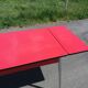 Dining table with red formica extensions