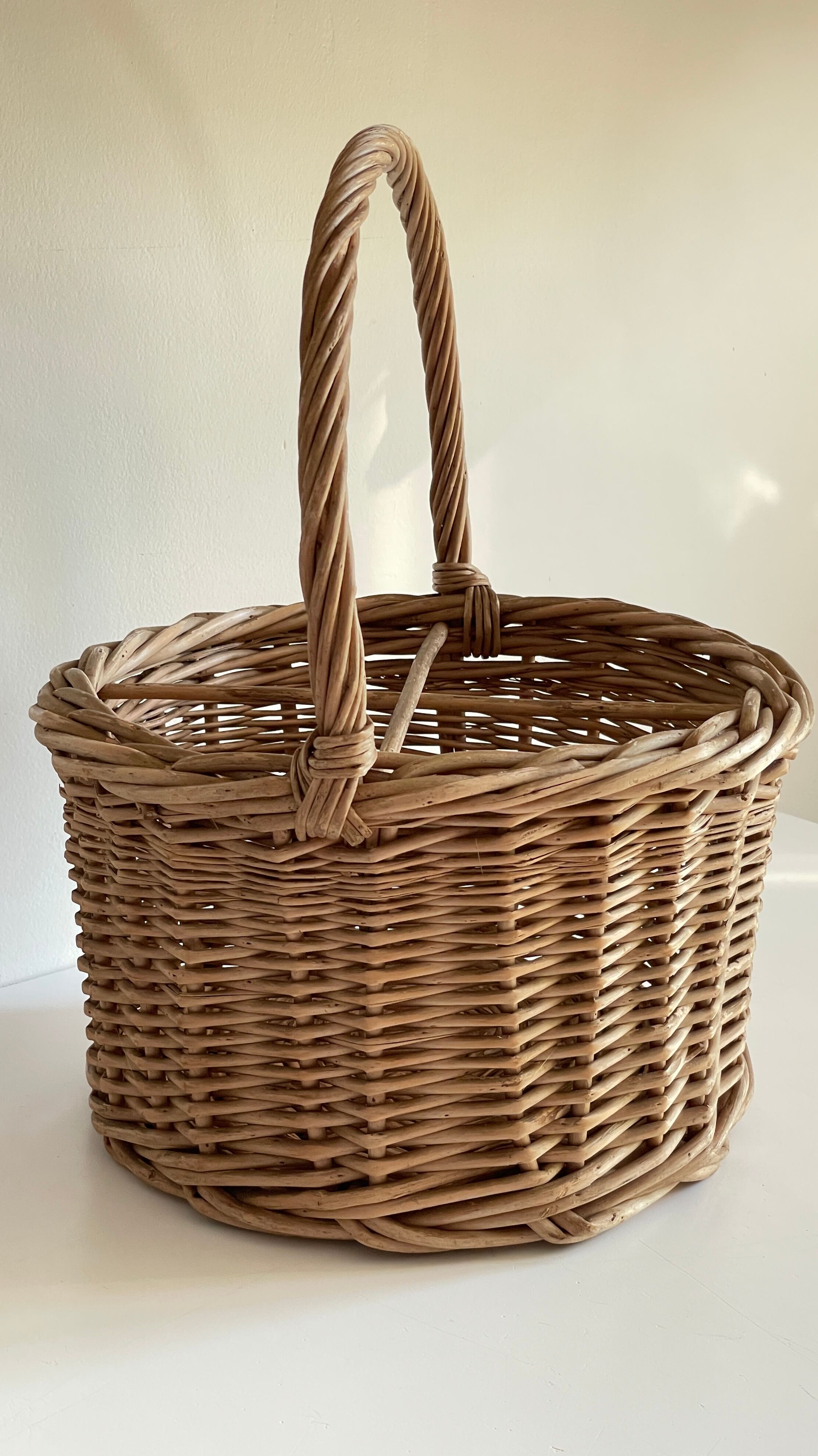 Basket with vintage rattan bottles