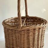 Basket with vintage rattan bottles