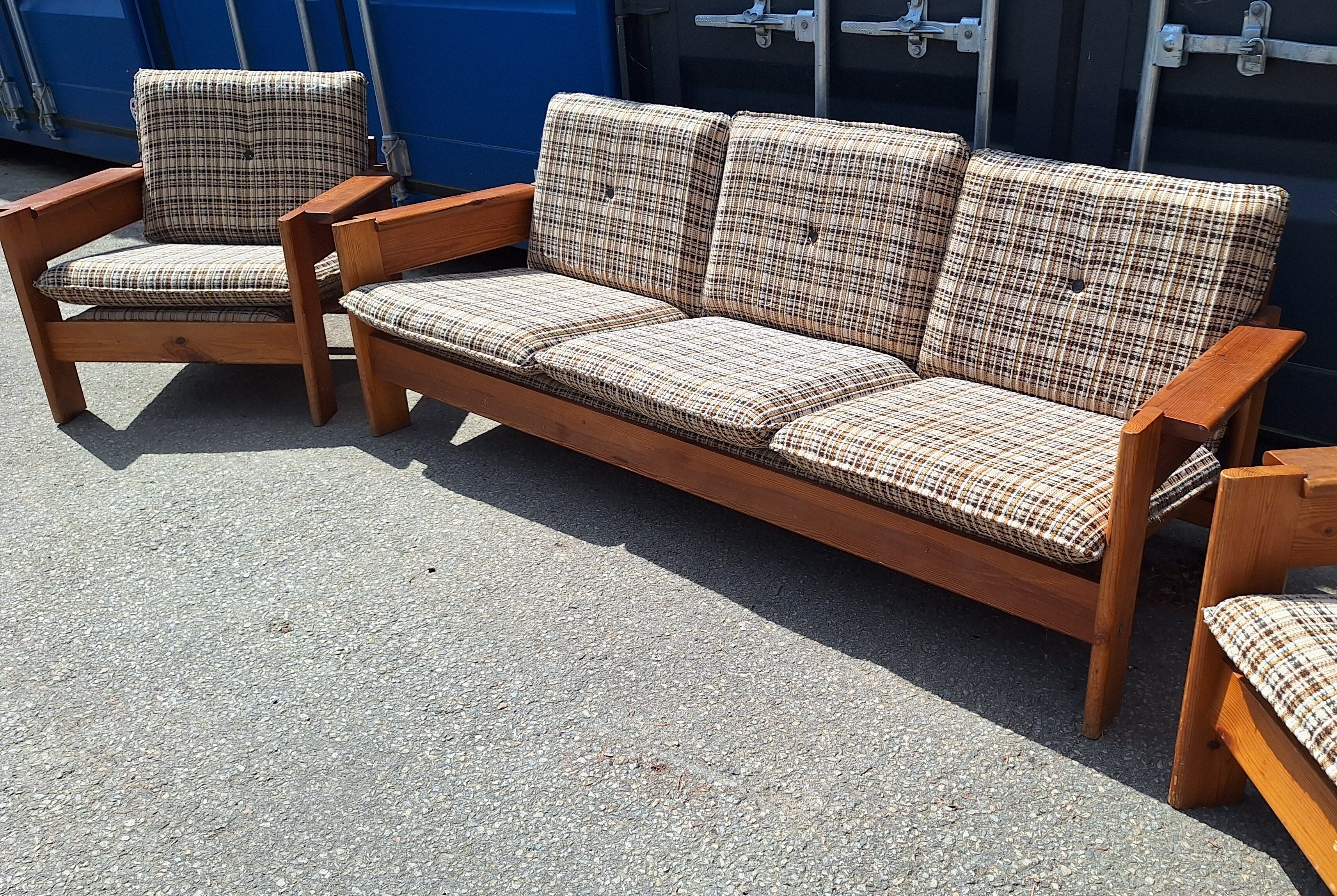 Brutalist-style bench and armchairs in 1970s pine.