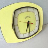 Pendule, Bayard wall clock in yellow formica from the 60s