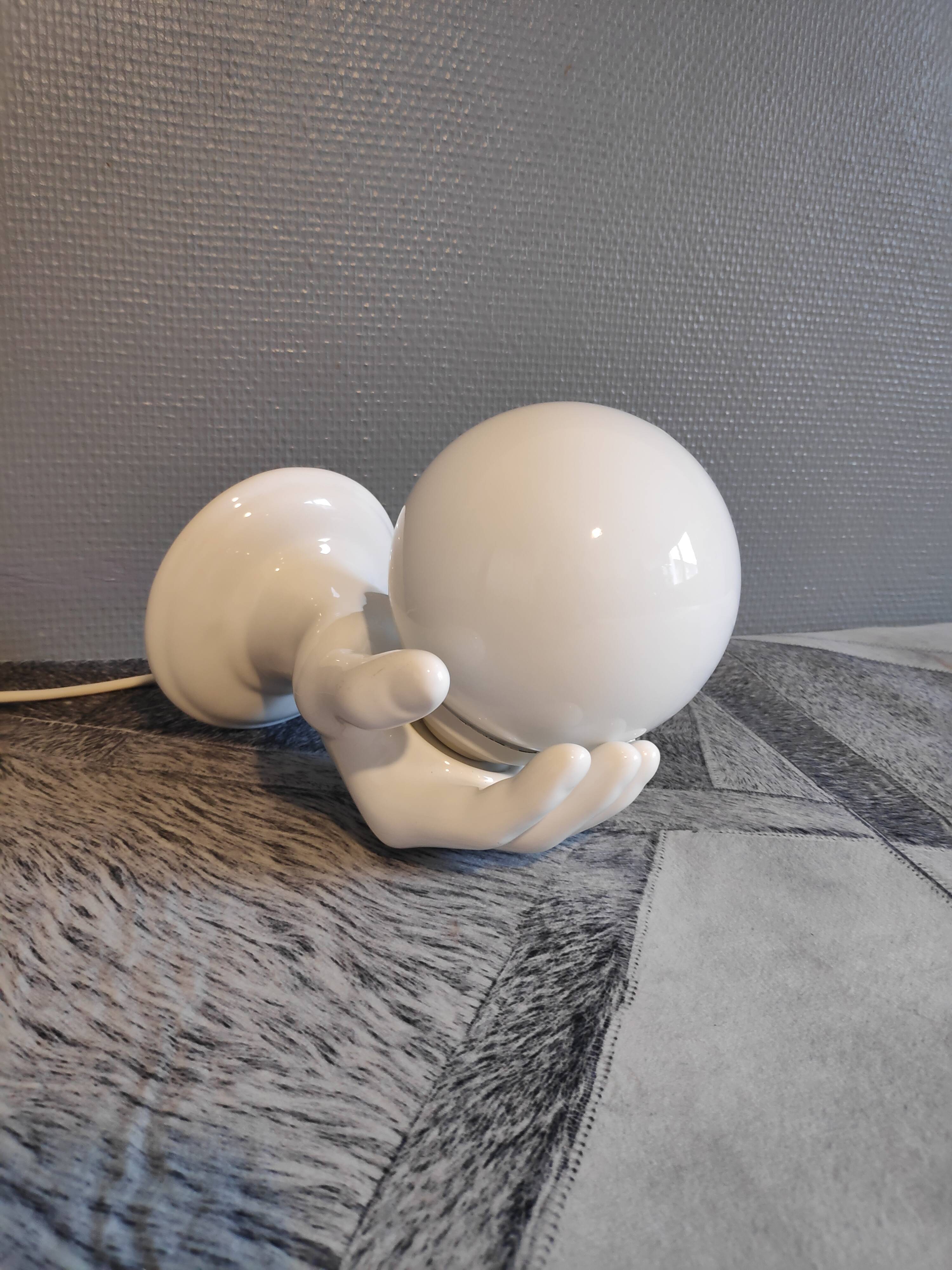 White ceramic hand sconce with white opaline globe