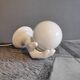 White ceramic hand sconce with white opaline globe