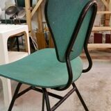 Chair in curved wood covered with vinyl, metal tube.