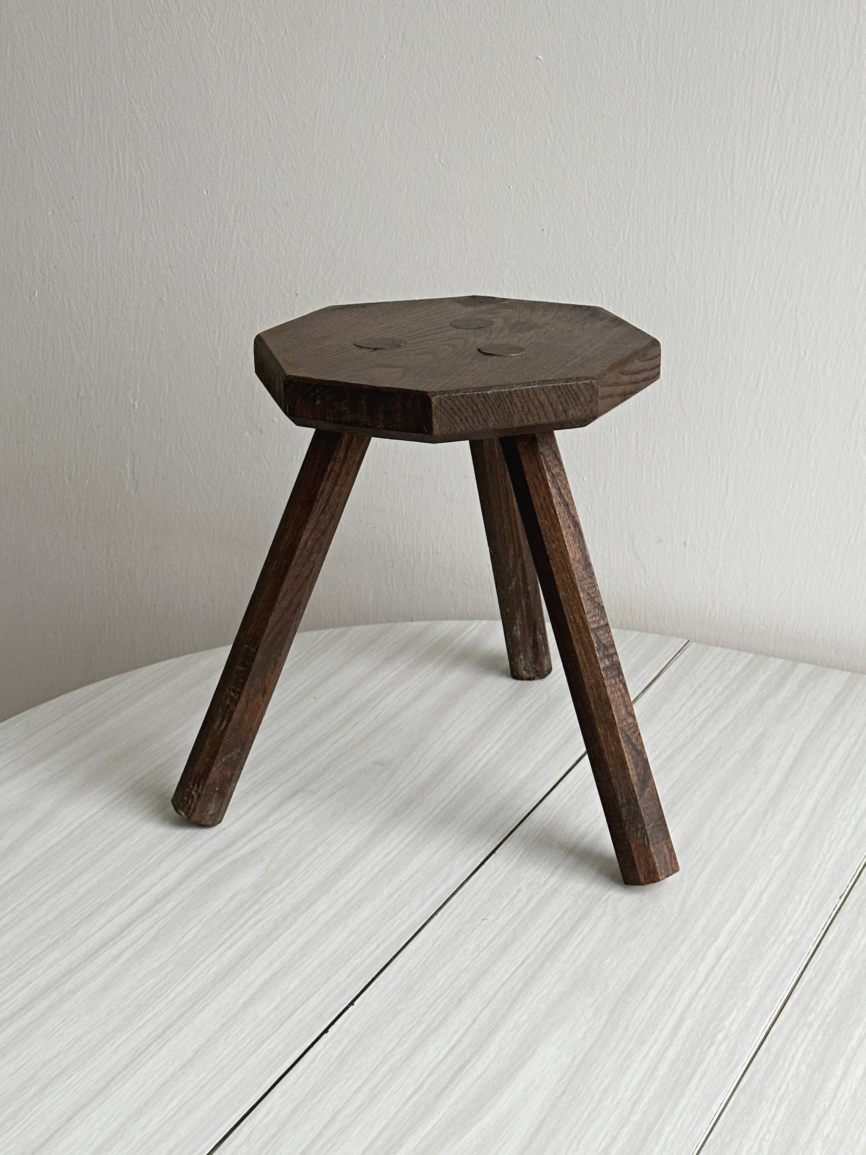 Small dark wooden tripod stool