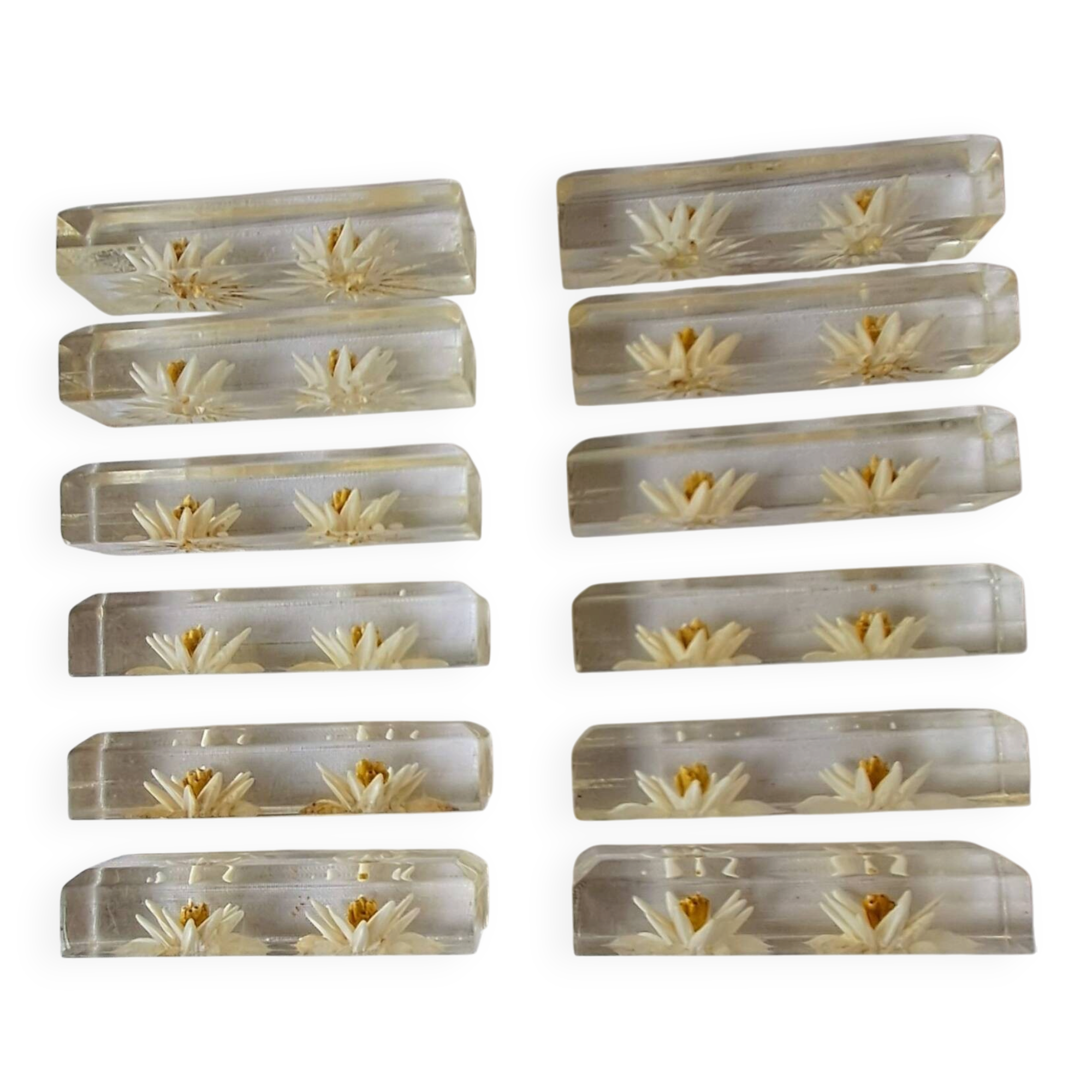 12 knife rests with resin inclusion. 1970s.