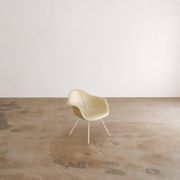 Eames fiberglass armchair by herman miller with white lax base