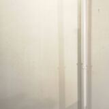 Adjustable metal floor lamp with its vintage smoked ball model from Roger Pradier 1970